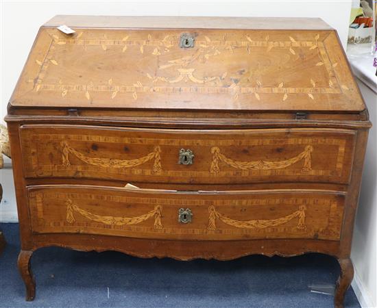 An 18th century continental marquetry inlaid walnut serpentine front bureau W.124cm